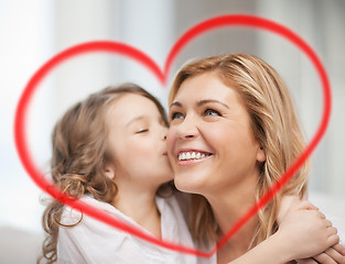 Image showing smiling mother and daughter hugging