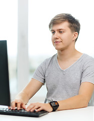 Image showing smiling student with computer