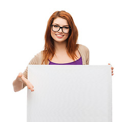 Image showing smiling girl with eyeglasses and white blank board