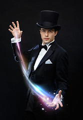 Image showing magician in top hat showing trick