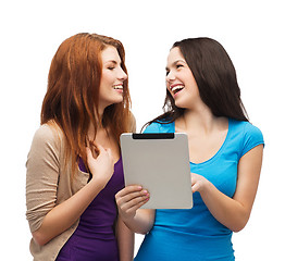 Image showing two smiling teenagers with tablet pc computer