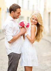 Image showing couple with flowers in the city