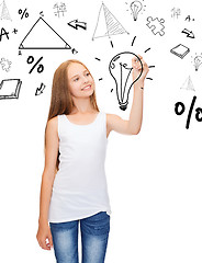 Image showing girl in white shirt drawing idea on virtual screen