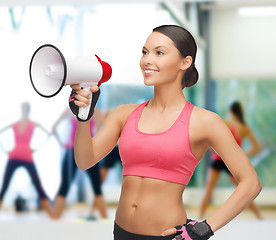 Image showing smiling fit woman with megaphone