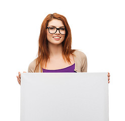 Image showing smiling girl with eyeglasses and white blank board