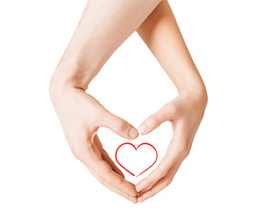 Image showing woman and man hands showing heart shape