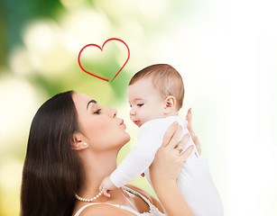 Image showing happy mother kissing her child