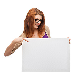 Image showing smiling girl with eyeglasses and white blank board