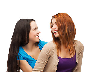 Image showing two laughing girls looking at each other