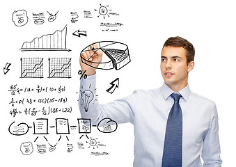 Image showing buisnessman drawing plan on virtual screen