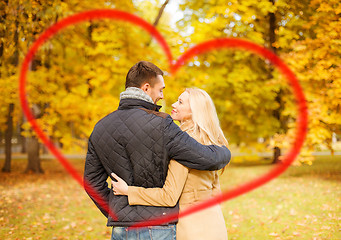 Image showing romantic couple kissing in the autumn park