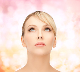 Image showing beautiful woman looking up