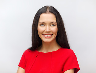 Image showing smiling young woman in red dress