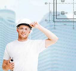 Image showing male architect in white helmet with blueprint