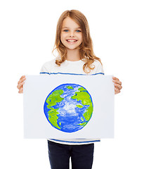 Image showing smiling little child holding picture of planet