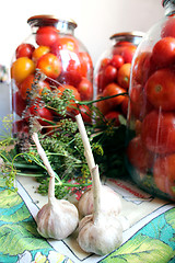 Image showing tomatos in jars prepared for preservation