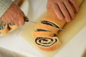 Image showing man hands closeup cutting pie