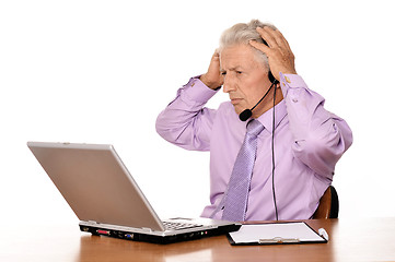 Image showing Elderly businessman with laptop