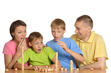 Image showing Happy family playing at table