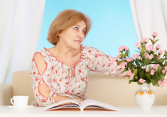 Image showing Beautiful older woman resting in the bedroom