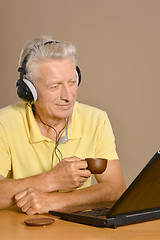 Image showing Elder man with laptop