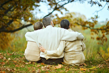 Image showing Happy family of three on the nature