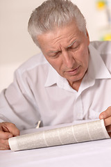 Image showing Senior man with newspaper