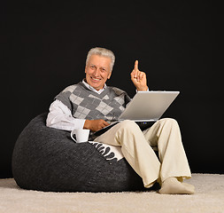 Image showing Elderly man with laptop