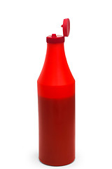 Image showing red ketchup plastic bottle isolated on white background