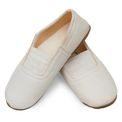 Image showing old children's white  pink pointe shoes ballet slippers isolated
