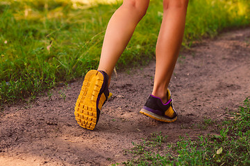 Image showing sports a shoes female large legs running, exercising and walking