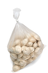 Image showing raw dumplings in a plastic cellophane bag isolated on white back