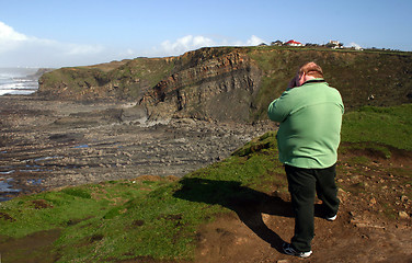 Image showing photographer on cliff top