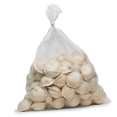 Image showing raw dumplings in plastic cellophane bag isolated on white backgr