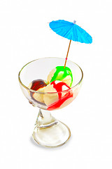 Image showing ice cream balls in a glass beaker isolated on white background