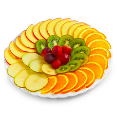 Image showing Salad of apples oranges grapes kiwi fruit slices on a plate isol