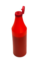 Image showing red plastic ketchup bottle isolated on white (clipping path)