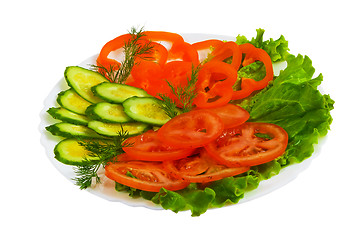 Image showing cucumbers tomatoes tasty sliced salad plate isolated on white ba