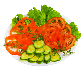 Image showing tomatoes cucumbers sliced salad plate isolated a on white backgr