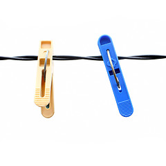Image showing clothespins on a rope on a white background