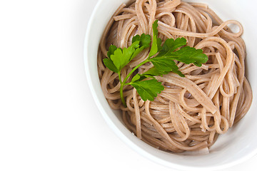 Image showing dark pasta in a bowl isolated a on white background