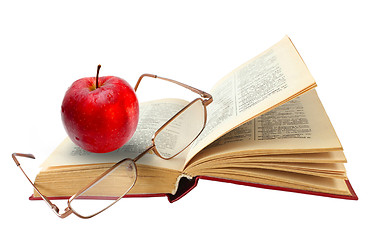 Image showing open book and glasses red apple on a white background (clipping 