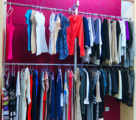 Image showing Shop different with clothes shopping, racks and shelves with wom