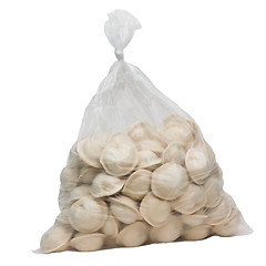 Image showing raw dumplings in a plastic cellophane bag isolated on white back