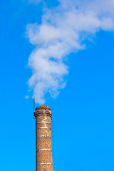 Image showing ecology pipe and smoke against the blue sky