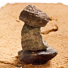 Image showing pile of stones in the sand