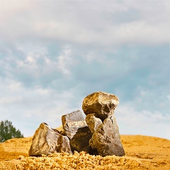 Image showing stones in the sand against the blue sky