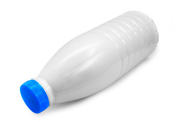 Image showing plastic milk bottle lies on side isolated on white (clipping pat