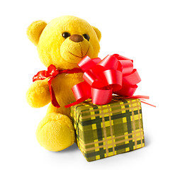 Image showing yellow teddy bear with gift isolated