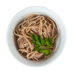 Image showing dark pasta in a bowl isolated on white background clipping path